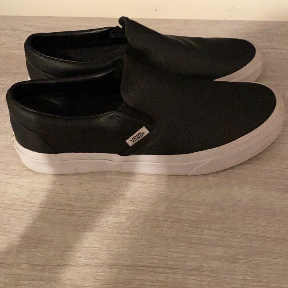Black leather Vans.